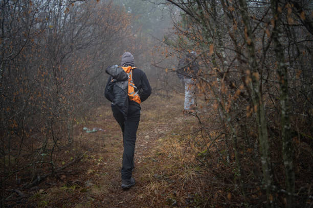 istock Hikers in foggy forest 1089029454