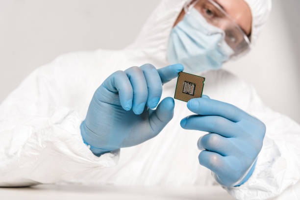 istock selective focus of microprocessor in hands of scientist in googles on grey background 1089035444