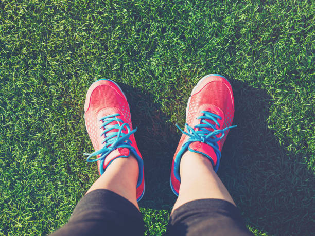 istock Female jogger looking down at her feet 1089035770