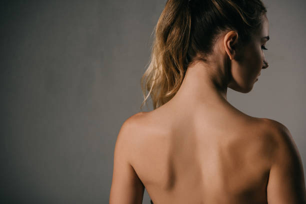 istock back view of woman with ponytail on grey background 1089036298