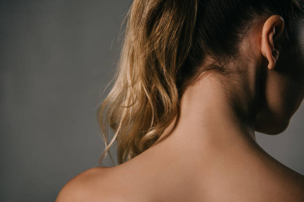istock back view of woman with ponytail on grey background 1089036316