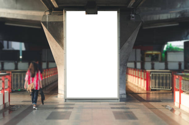 istock announcement billboard big blank white LED screen perspective vertical outstanding on sky train platform side pathway to railway for display advertisement text template promotion new brand outdoor. 1089040980