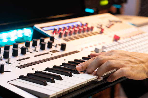 istock producer hands playing on midi keyboard synthesizer for recording in post production studio 1089042646