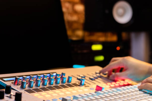 istock DJ, producer, composer, arranger hands adjusting sound mixer in recording, broadcasting studio 1089042674