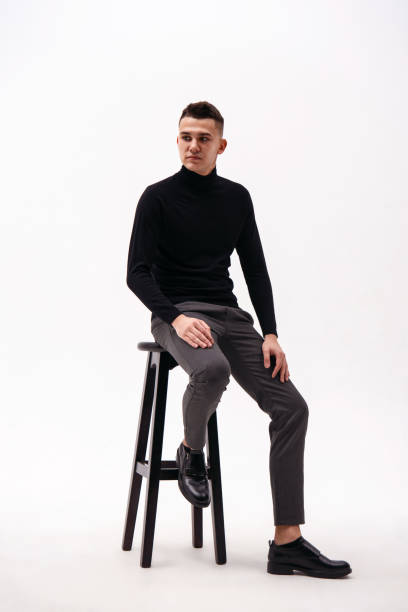 istock Handsome young man on the chair. Studio shot, isolated on the white background 1089043054