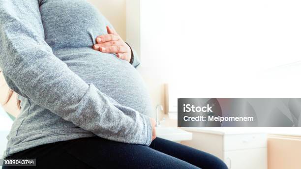 Pregnant Woman At The Hospital Stock Photo - Download Image Now - Care, Gynecologist, Pregnant