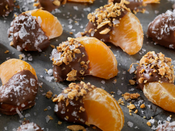 istock Chocolate Dipped Oranges with Roasted Nuts and Flake Salt 1089044372