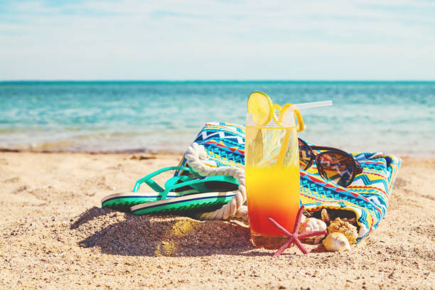 istock Beach background with a cocktail by the sea. Selective focus. 1089045854