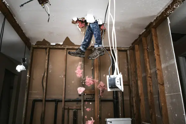 A man attempts to work on renovating his home, with funny and disastrous results.  He falls through the drywall ceiling feet first.