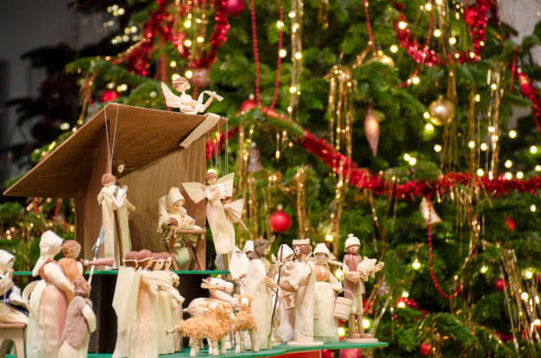 istock Christmas nativity scene with blurred Chrstmas tree in background. 1089047278