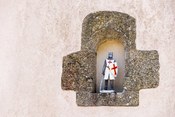 Templar knight figure Rochefort-en-Terre, France. Templar knight figure resting in a niche on a wall knights of malta stock pictures, royalty-free photos & images
