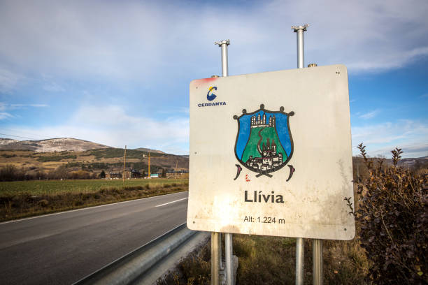 The welcome sign of Llívia Llívia, Spain - Nov 7th 2017 - The welcome sign of Llívia, a landlock state of Spain inside France in Europe llivia stock pictures, royalty-free photos & images