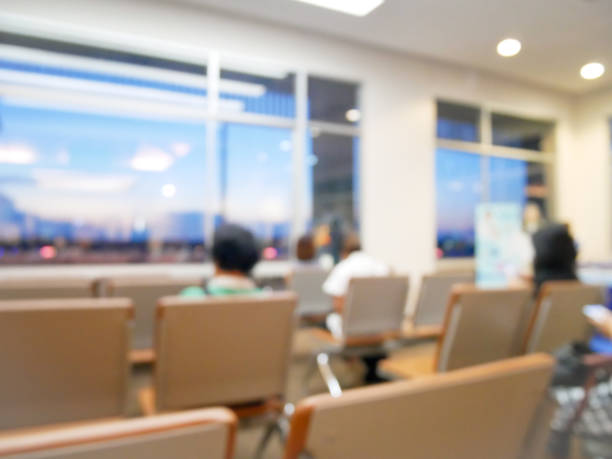 istock Blurred defocused image of travelers queue in terminal departure check-in point at international airport. Many people sitting on chair in gate waiting zone, waiting for flight to destination. 1089052944