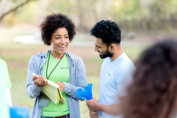 istock Female volunteer coordinator organizes community cleanup event 1089055470