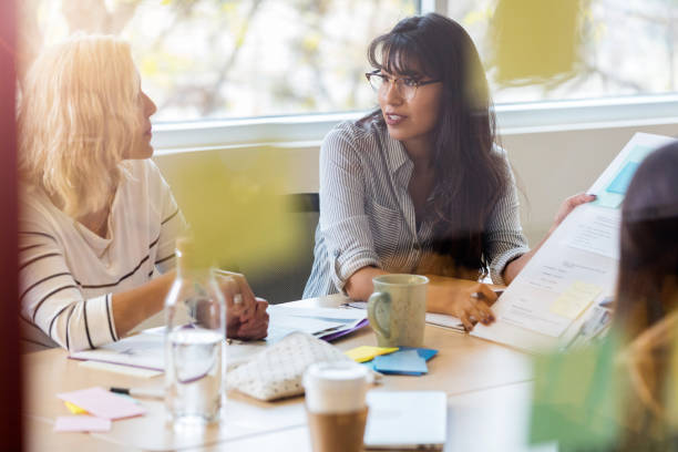 istock Creative group meets in a conference room to work on project 1089055758