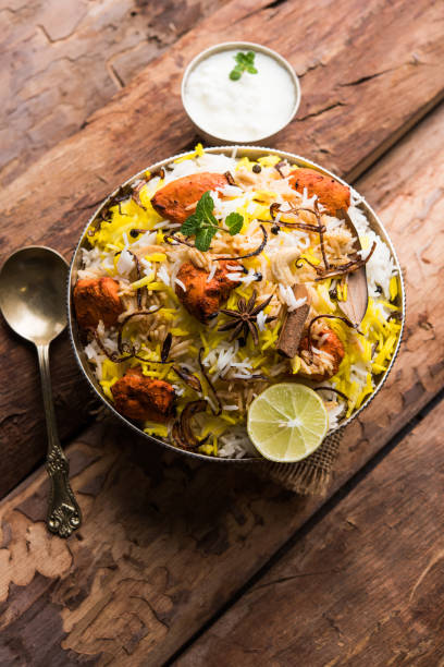 istock Indian Chicken Tikka Biriyani served in a bowl with yogurt. selective focus 1089056564