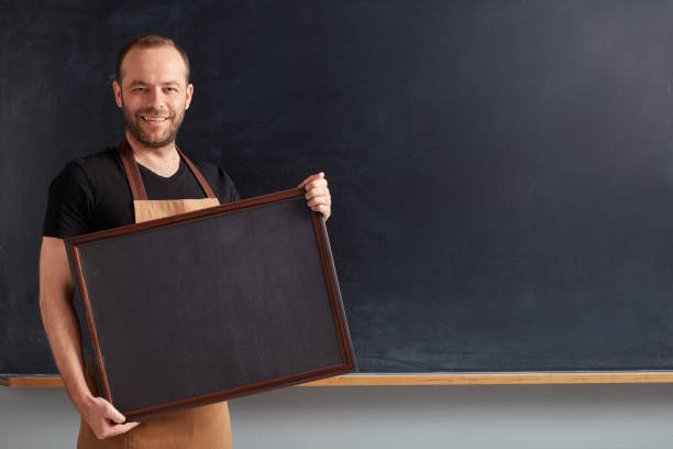 istock Barista posing with placard. 1089056670