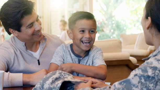 istock Cheerful little boy smiles at his army mom 1089057034
