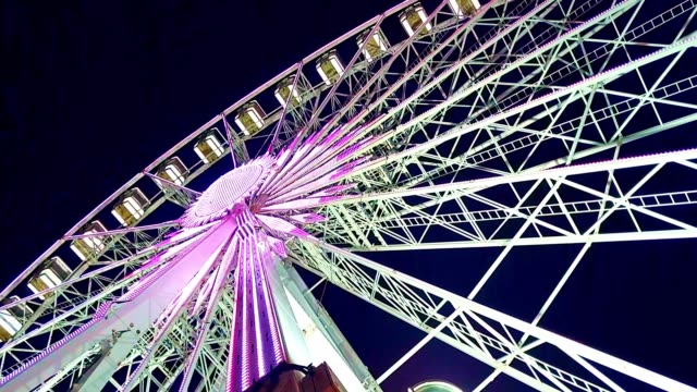 Ferris wheel at Amusement park at night