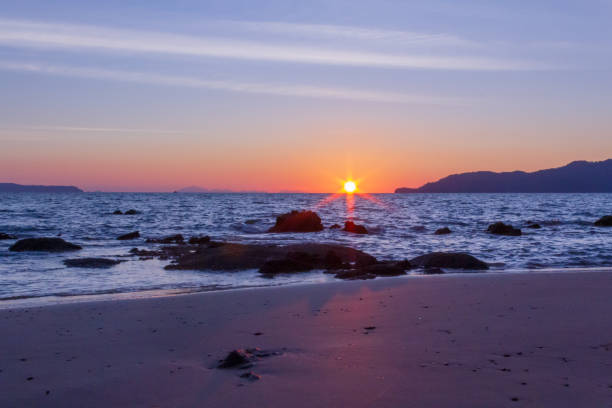 istock The sun is hiding the beach edge 1089063626
