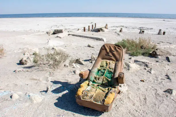 Old abandoned car seat sits on Bombay Beach in the Salton Sea area of California