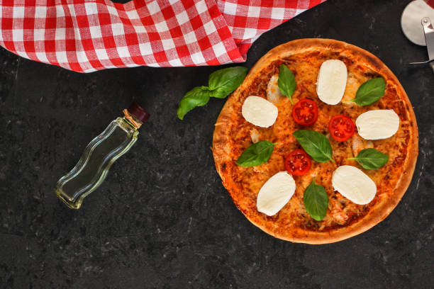 istock pizza with vegetables and cheese (broccoli, mozzarella basil and others). food background 1089068250