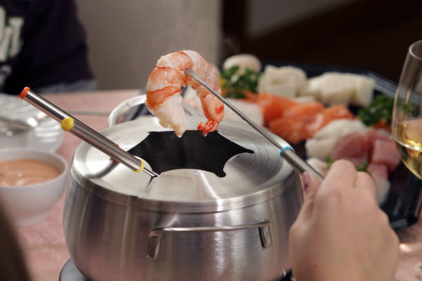 Fish fondue stock photo