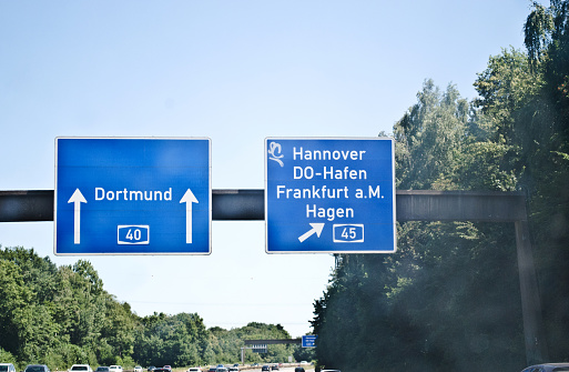 Blue motorway signs with directions to Dortmund, Hannover, Dortmund-Hafen, Frankfurt and Hagen in Germany