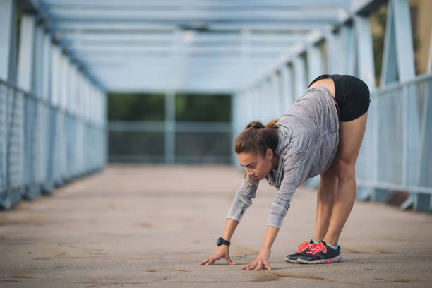 istock Young woman exercising outdoors 1089076612