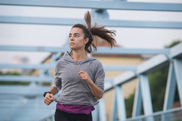 istock Young woman exercising outdoors 1089083714