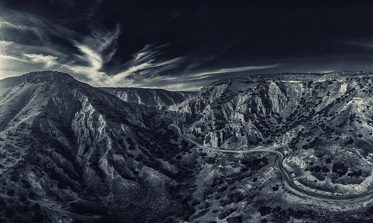 Black and White image of a Valley with geological formations.