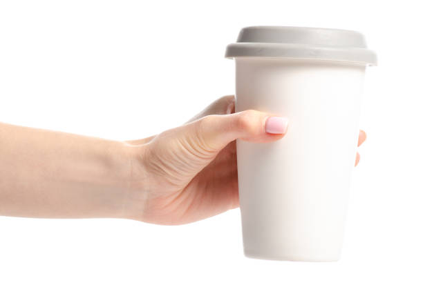 istock White cup mug with gray lid in hand 1089088544