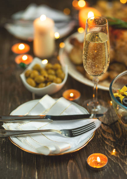 istock Festive champagne glass and romantic candlelit dinner, background for invitation 1089090784