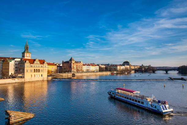 istock Boat navigating on Vltava river at sunset in Prague 1089091188