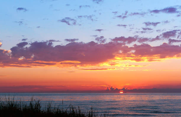 istock beautiful sunrise and waves on the sea 1089096052