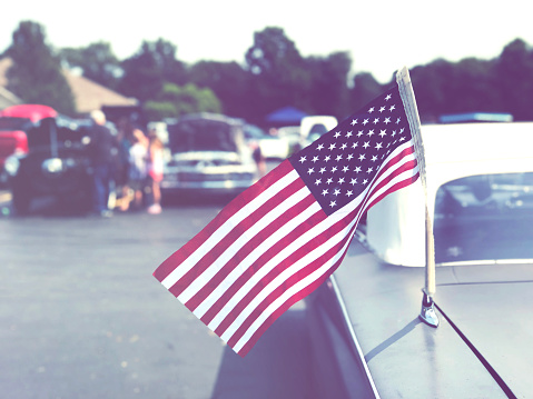 Vintage American Flag on Old Classic Car at Cruise In Car Show, Retro Style