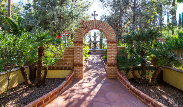 istock Brick Archway With Cross Leading To Fountain 1089099438