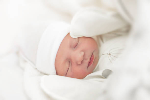 istock Sleepy baby close-up in a baby cot. 1089103054