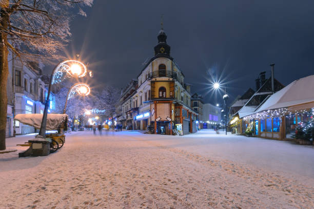Main street in Zakopane in the snow evening stock photo