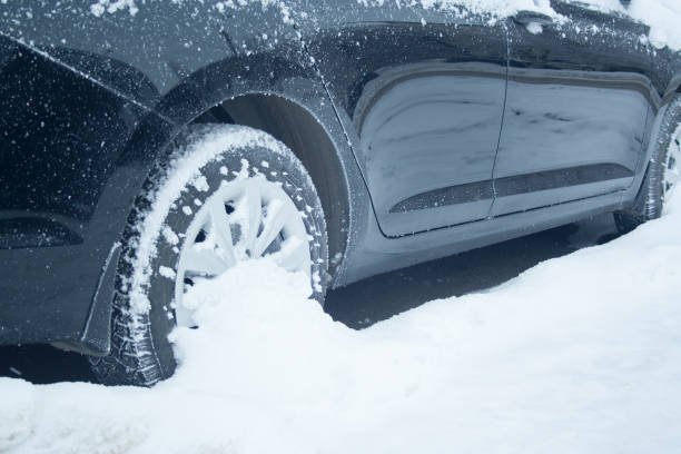 istock Wheel of car at snow 1089104348