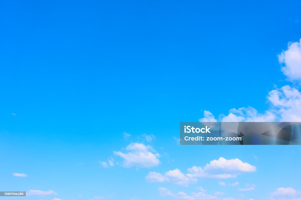 Blue spring sky with white clouds Blue spring sky with white clouds - natural background with large space for your own text Atmosphere Stock Photo