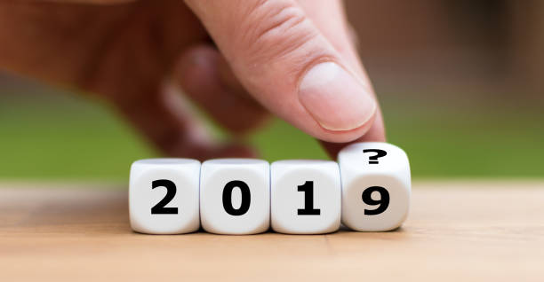 istock Hand is turning a dice and and changes the year 