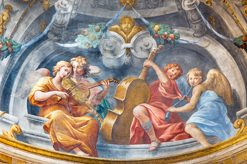 Parma - The symbolic fresco of angels with the music instruments in church  Chiesa di Santa Cristina by Filippo Maria Galletti (1636-1714).