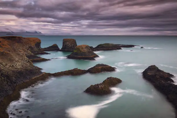 Photo of Volcanic cliffs and basalt rocks in Arnarstapi, Iceland