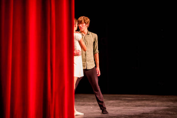 istock Young dancers performing on a theater stage 1089116386