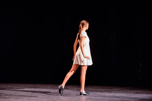 istock Young dancer performing on a theater stage 1089116398