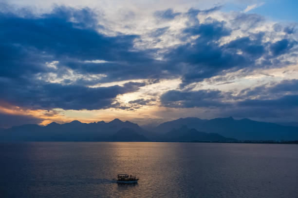 istock Tourists travelling by small ship in scenic marine background 1089116746