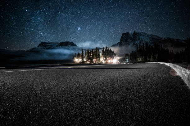 empty tarmac road under milky way by Emerald Lake in Yoho national park empty tarmac road under milky way by Emerald Lake in Yoho national park,British Columbia, Canada. yoho national park photos stock pictures, royalty-free photos & images