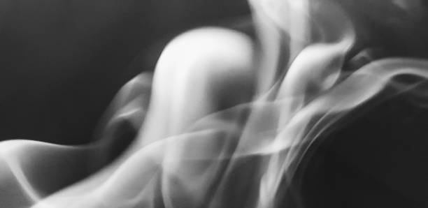 istock Wispy twirls of incense smoke against a dark background 1089120004