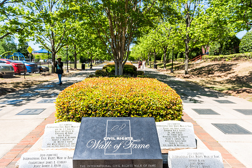 Atlanta, USA - April 20, 2018: Historic MLK Martin Luther King Jr National Park sign of walk of fame in Georgia downtown, green trees in urban city